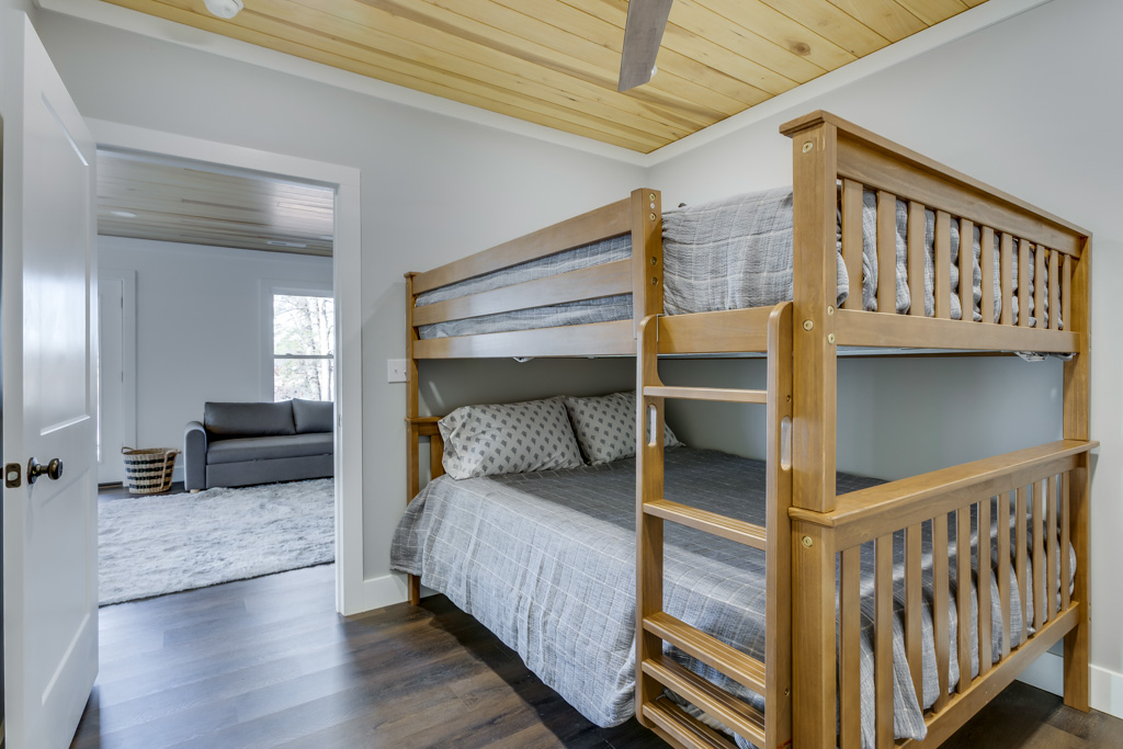 Basement bedroom with queen bunks